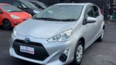 front side view of silver 2016 Toyota Aqua