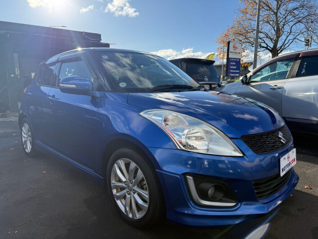 front side view of blue 2014 Suzuki Swift