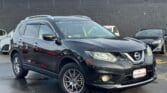 front side view of black 2014 Nissan X-Trail