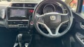 2014 Honda Fit steering wheel and front seats view