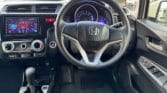 steering wheel and inside view of 2014 Honda Fit
