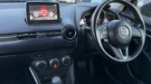 front inside view of red 2016 Mazda Demio