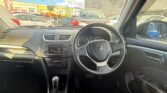 front seats view of blue luxury 2014 Suzuki Swift