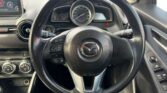 steering wheel view of 2014 Mazda Demio
