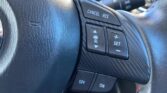 steering wheel closeup view of 2014 Mazda Axela