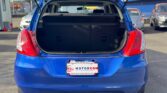 open trunk view of blue 2014 Suzuki Swift