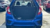 open trunk view of blue 2014 Honda Fit