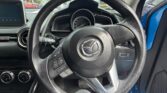 steering wheel view of 2014 Mazda Demio