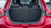 open trunk view of red 2016 Mazda Demio