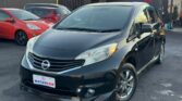 front side view of black 2014 Nissan Note