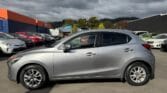 full side view of 2014 Mazda Demio