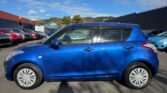 side view of blue 2014 Suzuki Swift