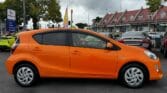 orange 2016 Toyota Aqua S full side view