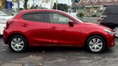 full side view of 2014 Mazda Demio