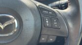 steering wheel closeup view of 2014 Mazda Axela