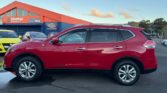 full side view of red 2016 Nissan X-Trail