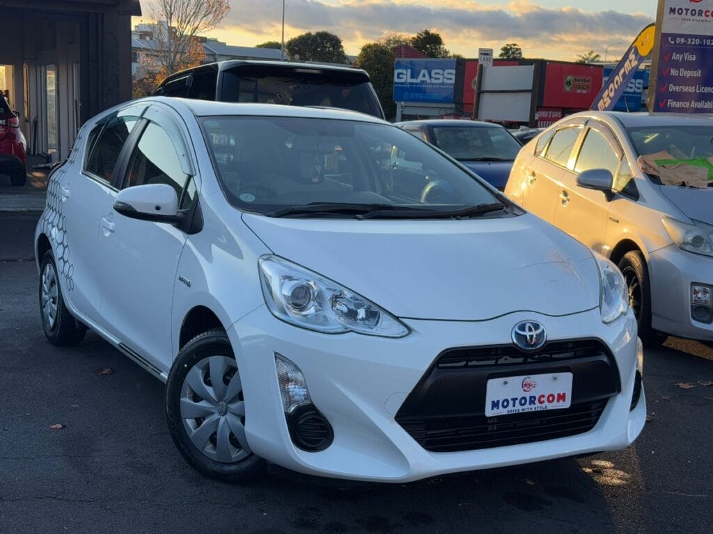front side view of white 2017 Toyota Aqua