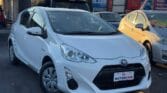 front side view of white 2017 Toyota Aqua