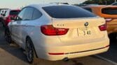 back side view of white 2014 BMW 320i
