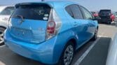 blue 2015 Toyota Aqua back side view