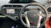 steering wheel of 2012 Toyota Aqua