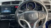 inside view of steering wheel of 2013 Honda Fit