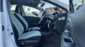front door open view of white 2017 Toyota Aqua
