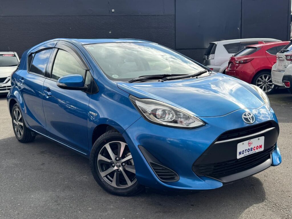 front side view of used blue 2017 Toyota Aqua