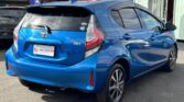back side view of used blue 2017 Toyota Aqua