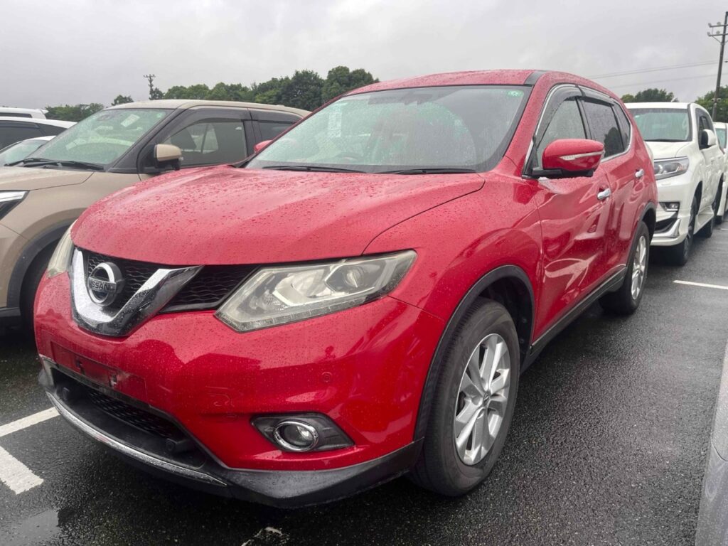 front side view of red 2015 Nissan X-Trail