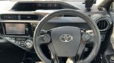 steering wheel view of 2016 Toyota Aqua