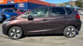 full side view of brown 2017 Honda Fit HYBRID