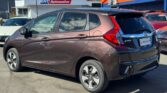 back side view of brown 2017 Honda Fit HYBRID