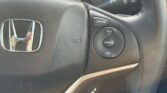 closeup view of steering wheel of black used 2015 Honda Grace