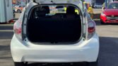 open trunk view of white 2014 Toyota Aqua