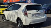 back side view of white 2014 Toyota Aqua