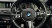 steering wheel view of 2014 BMW 523i