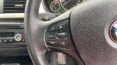 steering wheel closeup view of 2014 BMW 320i