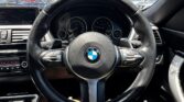 steering wheel view of 2014 BMW 320i