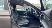 front door open view of 2014 BMW 320i
