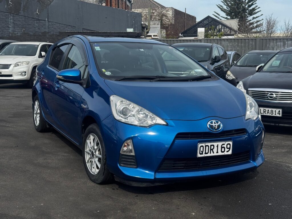 front side view of blue 2012 Toyota Aqua