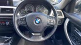 used 2014 BMW 320i steering wheel view