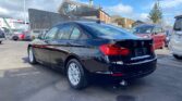 used 2014 BMW 320i back side view