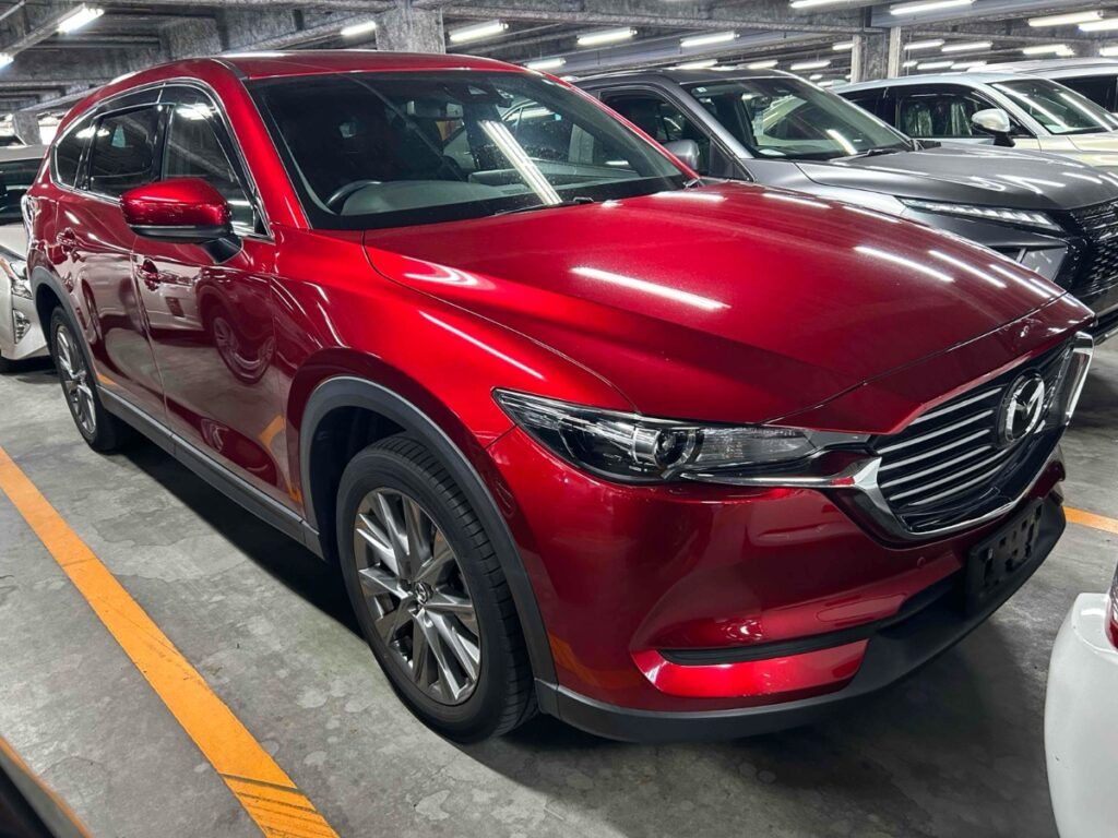 front side view of red 2020 Mazda CX-8