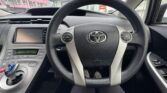 steering wheel view of 2015 Toyota Prius 5D