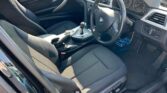 front door open view of 2014 BMW 320i