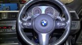 steering wheel view of 2014 BMW 320i