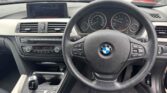 steering wheel view of used car 2014 BMW 320i
