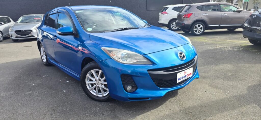 front side view of used blue 2012 Mazda Axela