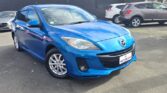 front side view of used blue 2012 Mazda Axela